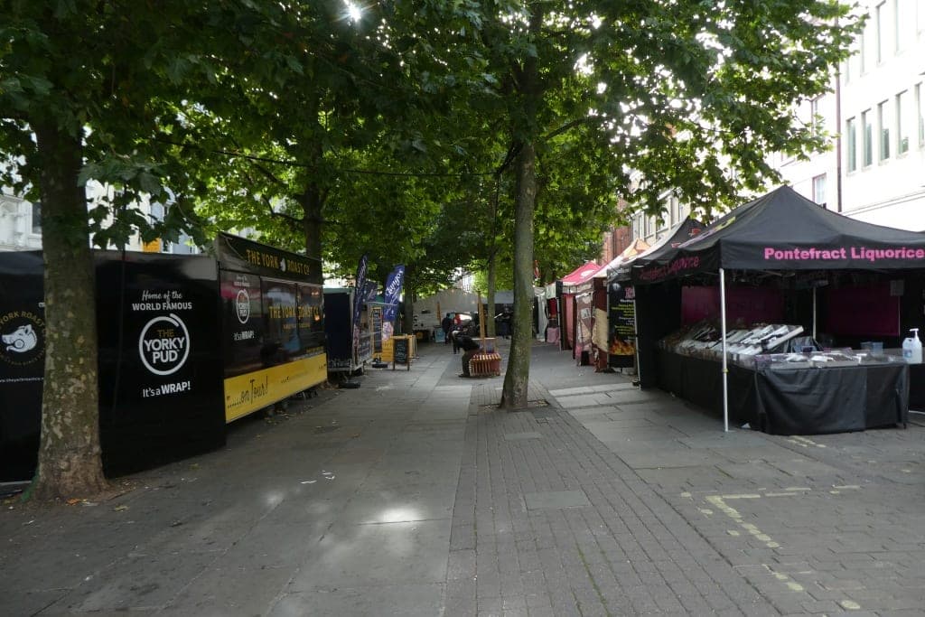 Market stalls and shoppers at the food and drink festival on Parliament Street in York city centre